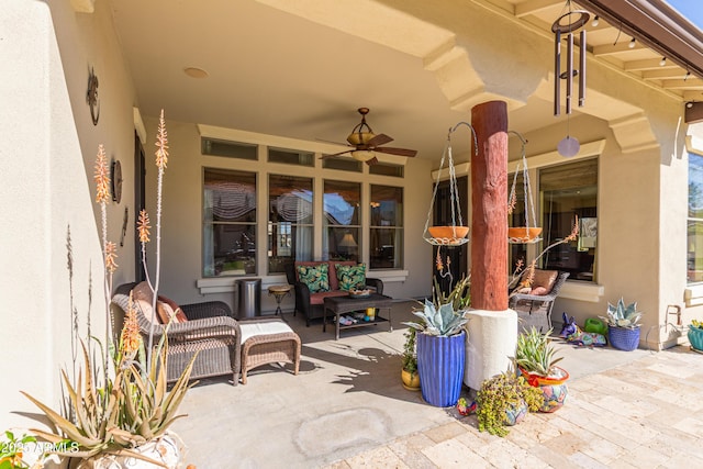 view of patio featuring ceiling fan and outdoor lounge area