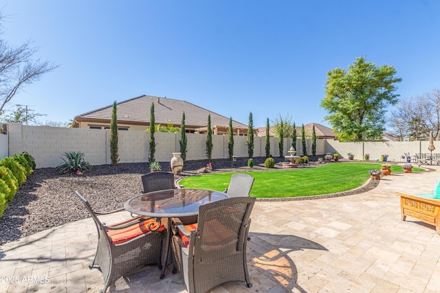 view of patio with a fenced backyard and outdoor dining space