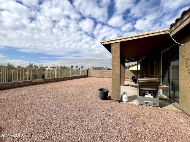 view of yard featuring a patio and a fenced backyard