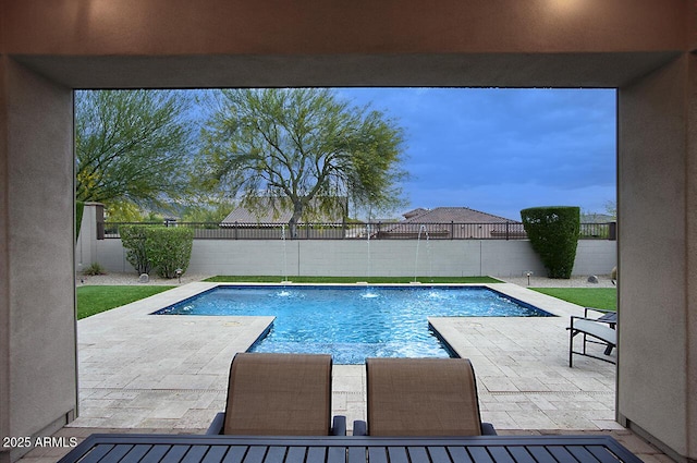 view of pool with a fenced in pool, a fenced backyard, and a patio area