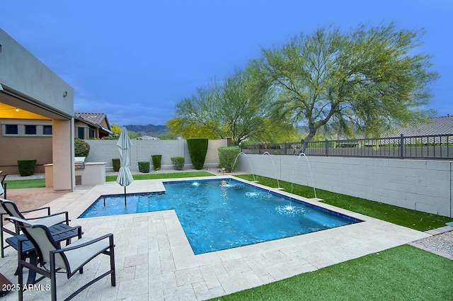 view of swimming pool featuring an outdoor kitchen, a fenced backyard, a fenced in pool, exterior bar, and a patio area