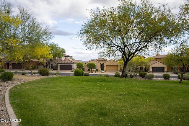 view of yard with a residential view and a garage
