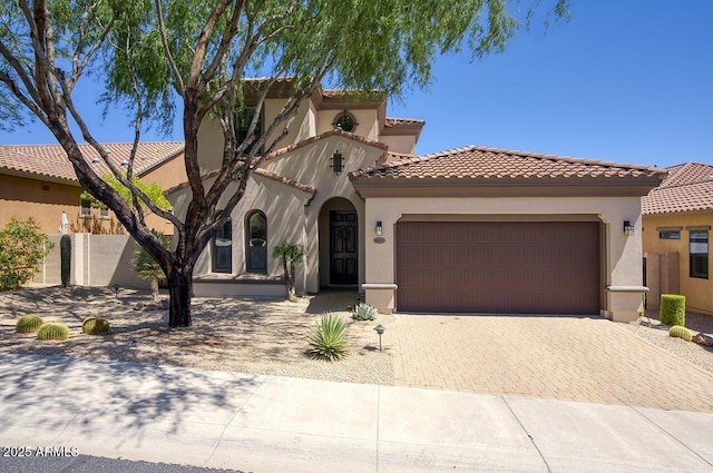 18515 N 97th Way, Scottsdale, AZ 85255 - mediterranean / spanish-style home with a garage, stucco siding, decorative driveway, and a tile roof