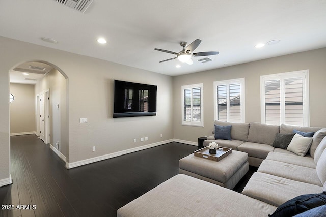 18515 N 97th Way, Scottsdale, AZ 85255 - living room with arched walkways, a ceiling fan, recessed lighting, baseboards, and dark wood-style floors