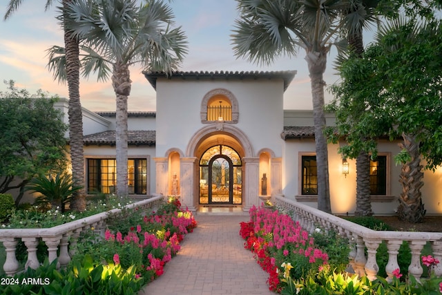 exterior entry at dusk with french doors