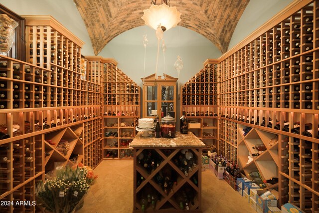 wine room featuring lofted ceiling