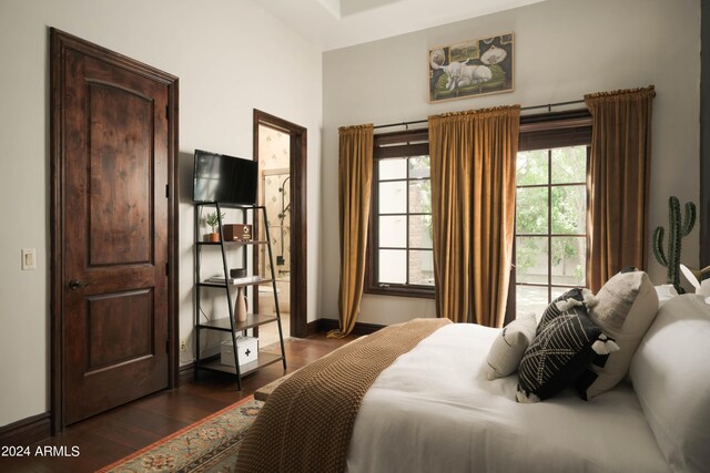 bedroom featuring dark hardwood / wood-style flooring