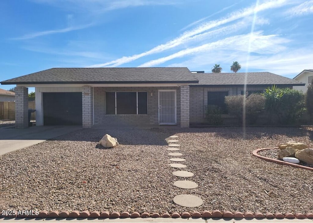 single story home featuring a garage