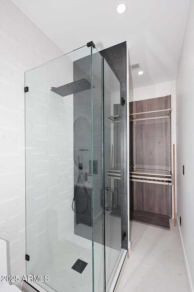 full bath with a stall shower, visible vents, baseboards, and recessed lighting