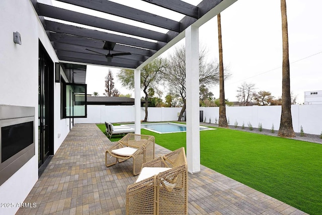 view of patio / terrace with a fenced in pool, a pergola, a fenced backyard, and a ceiling fan