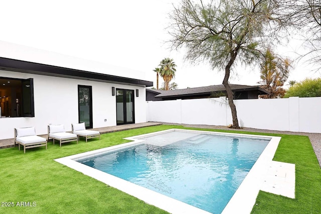 view of pool with a yard, a fenced backyard, and a fenced in pool