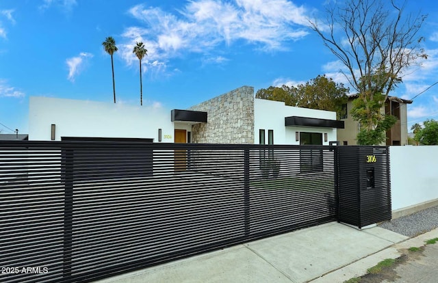 view of gate featuring a fenced front yard