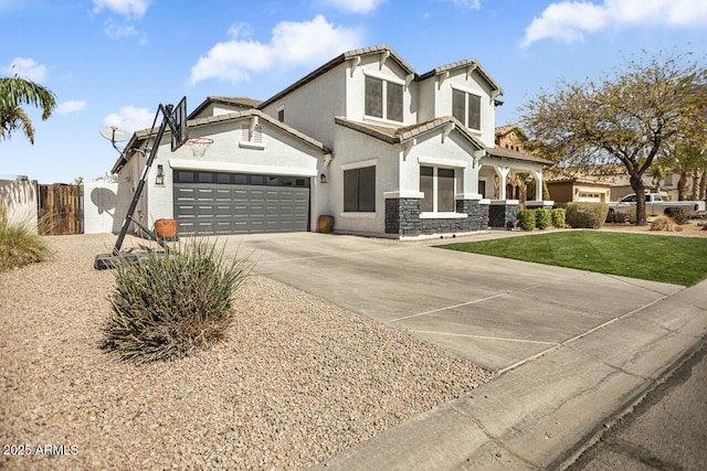 view of front facade with stucco siding, an attached garage, a gate, fence, and driveway