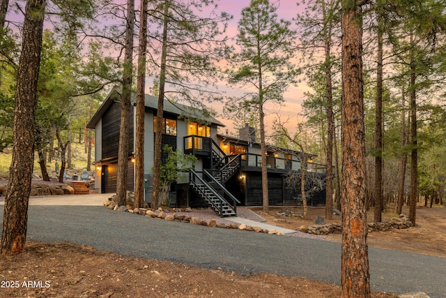 450 E Mount Elden Lookout Rd, Flagstaff, AZ 86001 - view of front of property with stairway, driveway, an attached garage, and a wooden deck