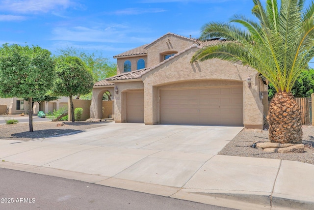 8710 N 182nd Ave, Waddell, AZ 85355 - mediterranean / spanish home with a garage, stucco siding, a tile roof, and concrete driveway