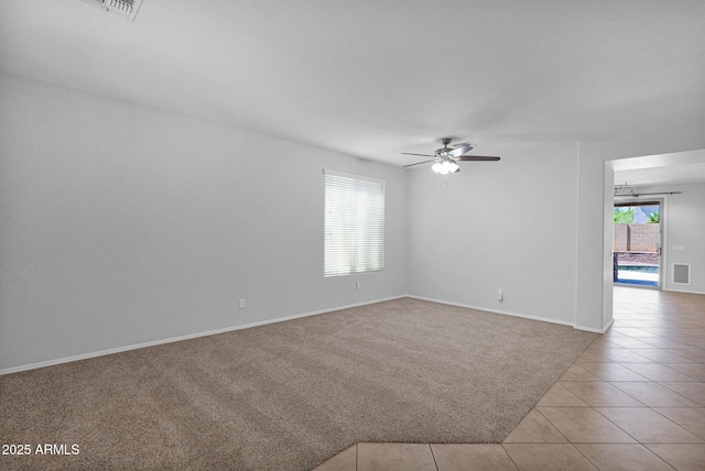 8710 N 182nd Ave, Waddell, AZ 85355 - carpeted empty room featuring ceiling fan, baseboards, and tile patterned flooring