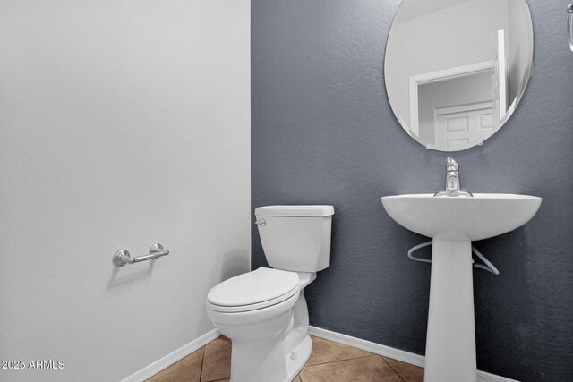 8710 N 182nd Ave, Waddell, AZ 85355 - bathroom featuring tile patterned flooring, baseboards, and toilet