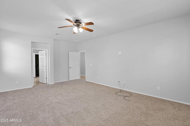 8710 N 182nd Ave, Waddell, AZ 85355 - spare room with light colored carpet, a ceiling fan, baseboards, and visible vents