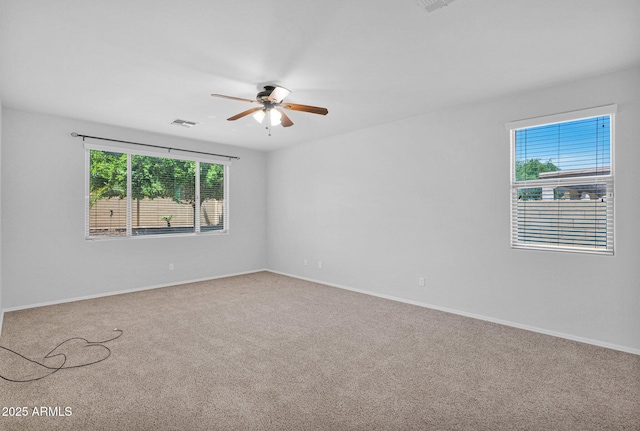 8710 N 182nd Ave, Waddell, AZ 85355 - carpeted spare room with visible vents, a ceiling fan, and baseboards