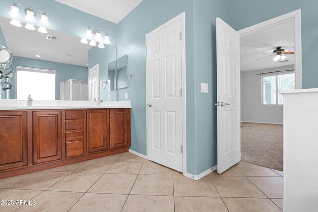 8710 N 182nd Ave, Waddell, AZ 85355 - bathroom with double vanity, tile patterned floors, a ceiling fan, baseboards, and visible vents