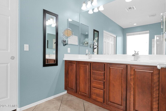 8710 N 182nd Ave, Waddell, AZ 85355 - bathroom featuring double vanity, baseboards, visible vents, and tile patterned flooring