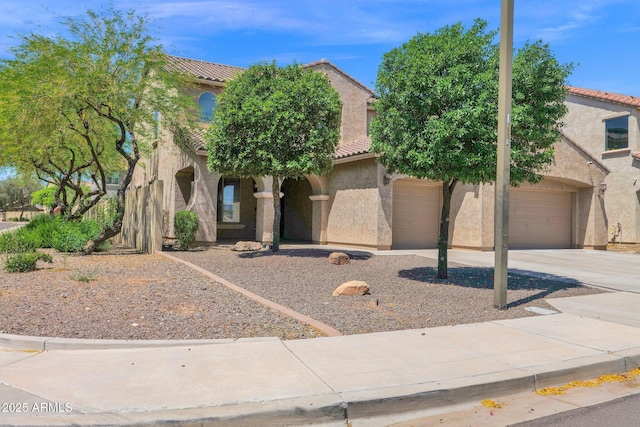 8710 N 182nd Ave, Waddell, AZ 85355 - view of front facade featuring a garage, stucco siding, concrete driveway, and a tile roof
