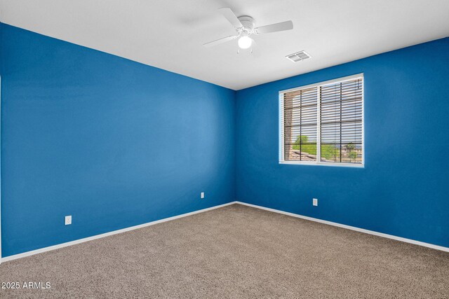 8710 N 182nd Ave, Waddell, AZ 85355 - carpeted spare room with visible vents, a ceiling fan, and baseboards
