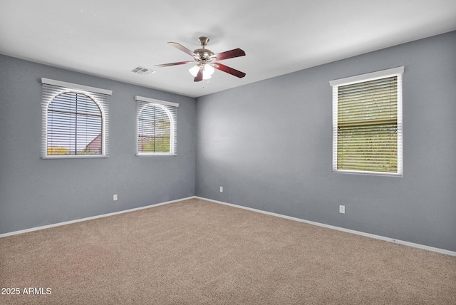 8710 N 182nd Ave, Waddell, AZ 85355 - carpeted empty room with a ceiling fan, baseboards, and visible vents