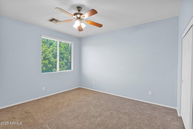 8710 N 182nd Ave, Waddell, AZ 85355 - spare room with a ceiling fan, baseboards, visible vents, and carpet