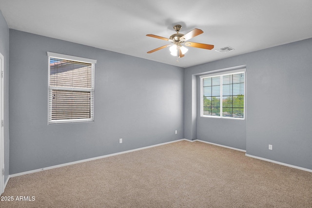 8710 N 182nd Ave, Waddell, AZ 85355 - empty room with carpet flooring, ceiling fan, visible vents, and baseboards