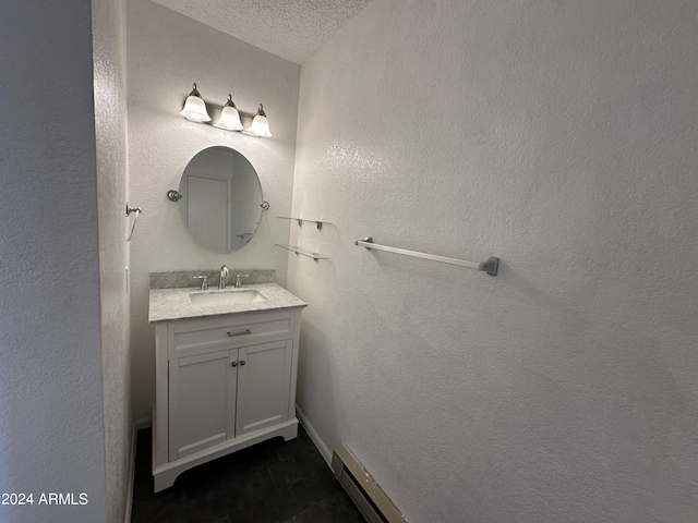 bathroom with vanity and a textured ceiling