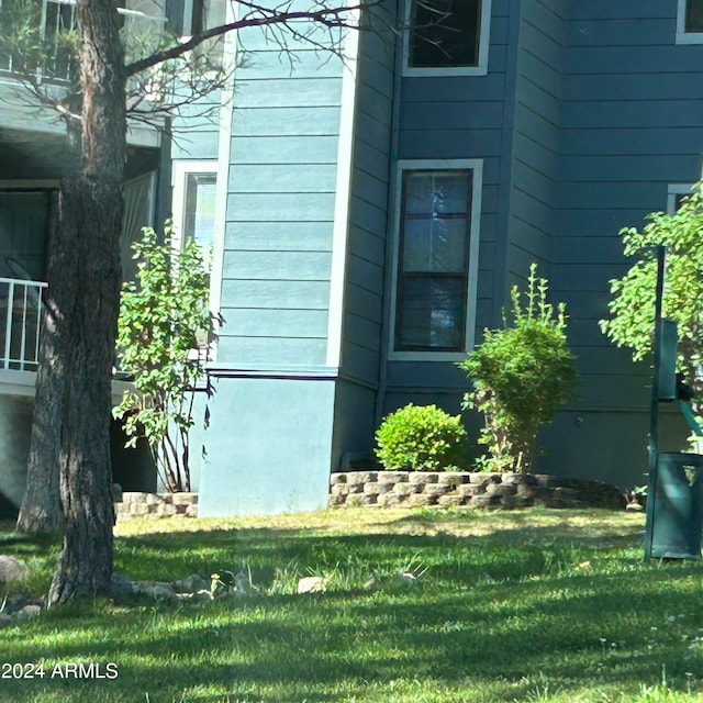 view of property exterior featuring a yard