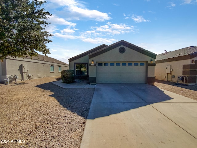 ranch-style home featuring a garage