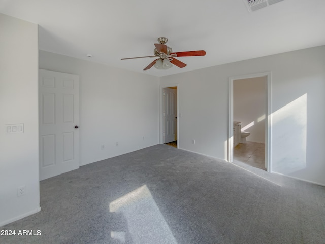 spare room with light colored carpet and ceiling fan