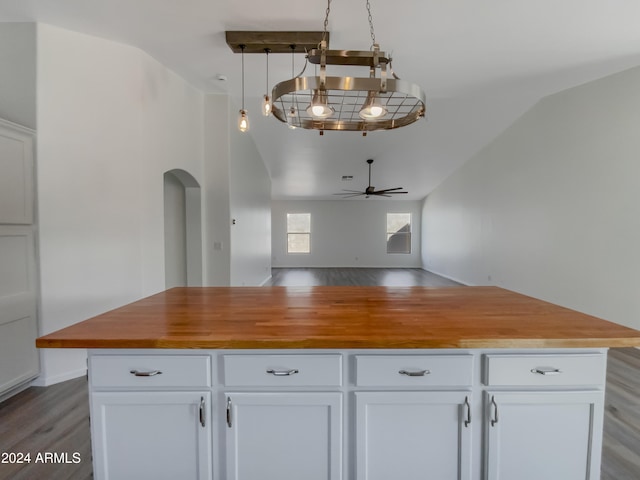 kitchen featuring white cabinetry, lofted ceiling, hardwood / wood-style flooring, and ceiling fan