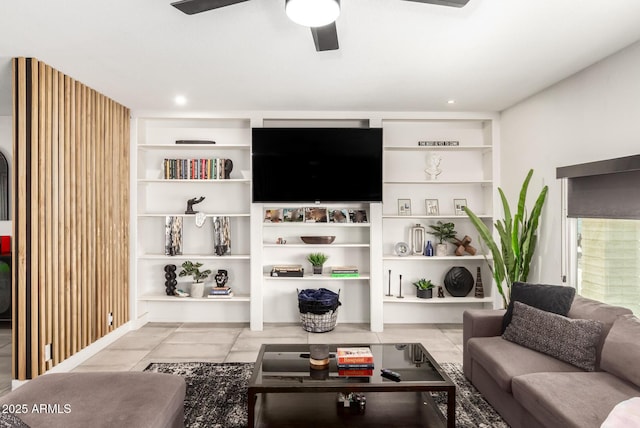 living room featuring ceiling fan and light tile patterned floors