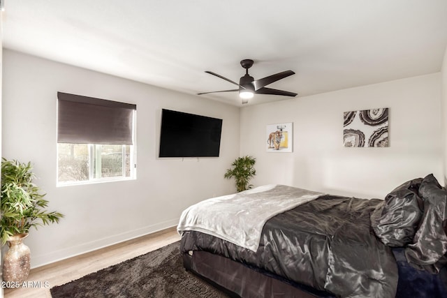 bedroom with ceiling fan and light wood-type flooring