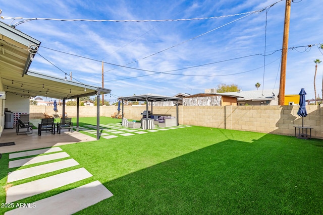 view of yard featuring a patio area and outdoor lounge area