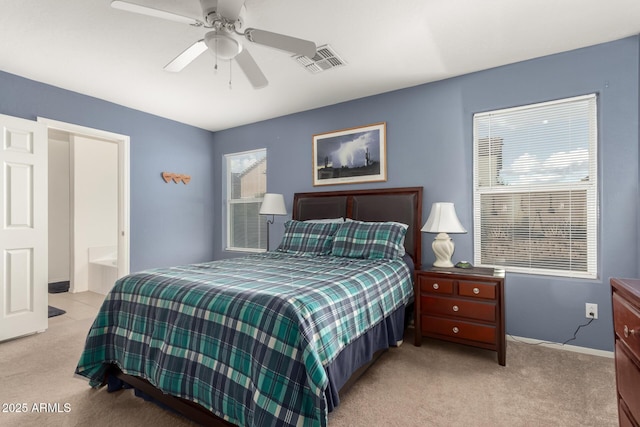 bedroom featuring visible vents, ceiling fan, and light carpet