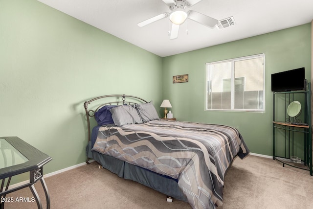 bedroom with baseboards, ceiling fan, visible vents, and light colored carpet