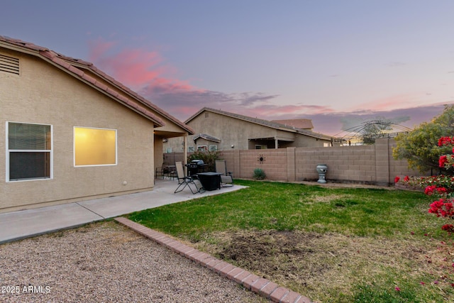 view of yard with a fenced backyard and a patio