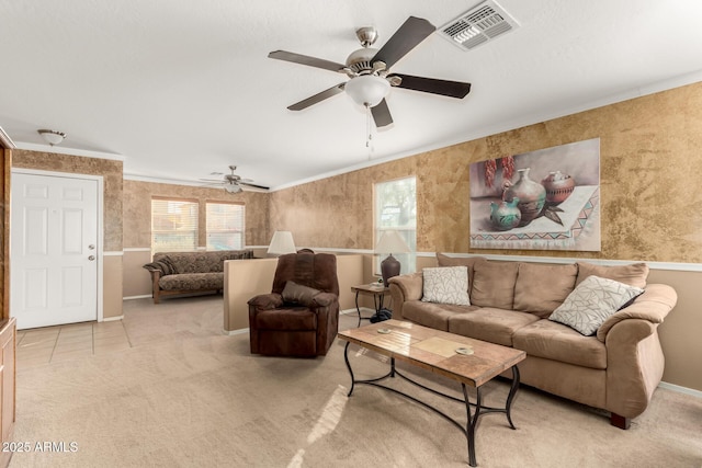 living area with plenty of natural light, visible vents, and light colored carpet