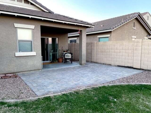 back of property featuring a patio area