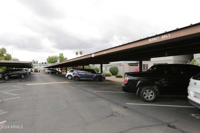 view of parking / parking lot with a carport