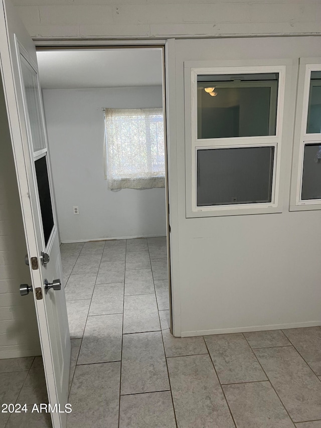 hallway with light tile patterned flooring