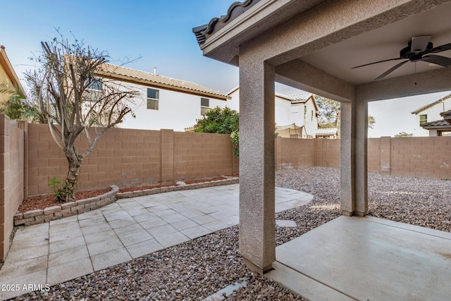 view of patio featuring a ceiling fan and a fenced backyard