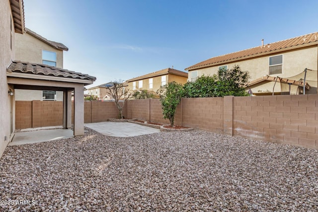 view of yard featuring a fenced backyard and a patio