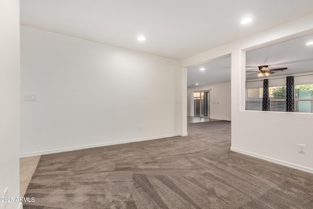 carpeted spare room featuring baseboards, ceiling fan, and recessed lighting