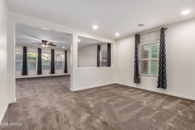 carpeted empty room with recessed lighting, visible vents, ceiling fan, and baseboards