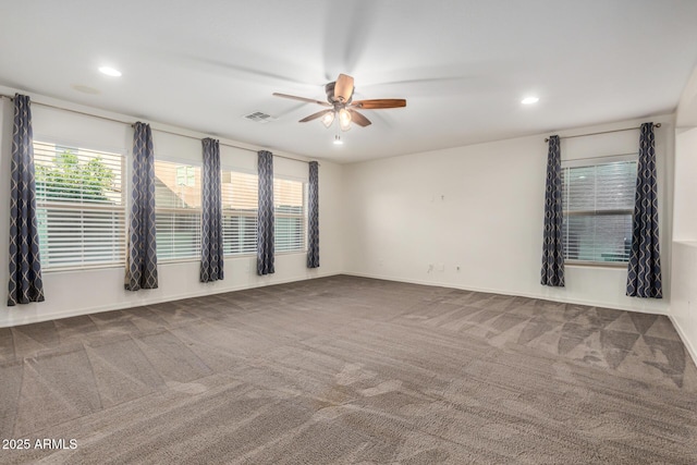 unfurnished room featuring ceiling fan, recessed lighting, carpet floors, visible vents, and baseboards